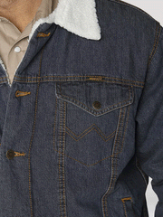 Wrangler 74256RT Mens Western Sherpa Lined Denim Trucker Jacket Rustic close up view of front chest pocket. If you need any assistance with this item or the purchase of this item please call us at five six one seven four eight eight eight zero one Monday through Saturday 10:00a.m EST to 8:00 p.m EST