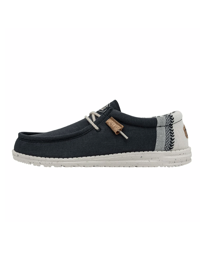 Hey Dude 40015-410 Mens Wally Break Stitch Shoe Navy front and side view. If you need any assistance with this item or the purchase of this item please call us at five six one seven four eight eight eight zero one Monday through Saturday 10:00a.m EST to 8:00 p.m EST