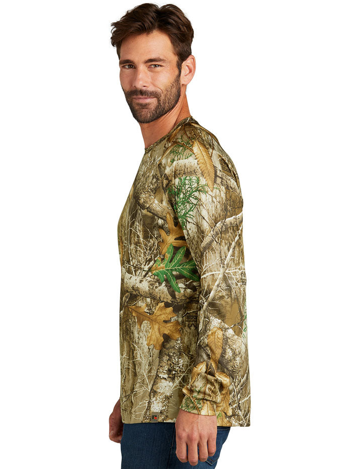 Russell Outdoors RU150LS Mens Performance Long Sleeve Tee Realtree Edge front view. If you need any assistance with this item or the purchase of this item please call us at five six one seven four eight eight eight zero one Monday through Saturday 10:00a.m EST to 8:00 p.m EST