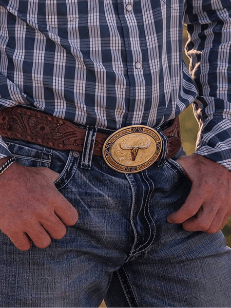 Montana Silversmiths 50310-974XL Southwest Edge Buckle With Longhorn Silver on model. If you need any assistance with this item or the purchase of this item please call us at five six one seven four eight eight eight zero one Monday through Saturday 10:00a.m EST to 8:00 p.m EST