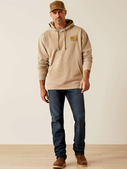 Ariat 10052460 Mens Camo Hex Hoodie Beige front full view of model. If you need any assistance with this item or the purchase of this item please call us at five six one seven four eight eight eight zero one Monday through Saturday 10:00a.m EST to 8:00 p.m EST