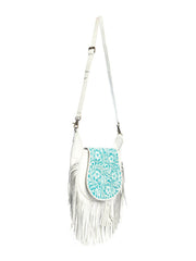 Myra Bag S-10762 Womens Moonwood Hand-Tooled Bag White side view hanging. If you need any assistance with this item or the purchase of this item please call us at five six one seven four eight eight eight zero one Monday through Saturday 10:00a.m EST to 8:00 p.m EST