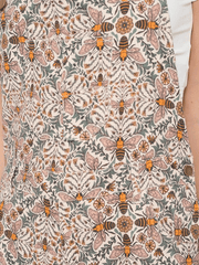 SM Wardrobe AW2431 Womens Bee Floral Print Overalls Tan fabric close up. If you need any assistance with this item or the purchase of this item please call us at five six one seven four eight eight eight zero one Monday through Saturday 10:00a.m EST to 8:00 p.m EST