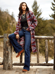 Ariat 10047001 Womens Memphis Western Boot Penny Roughout on model wearing boots outdoors. If you need any assistance with this item or the purchase of this item please call us at five six one seven four eight eight eight zero one Monday through Saturday 10:00a.m EST to 8:00 p.m EST
