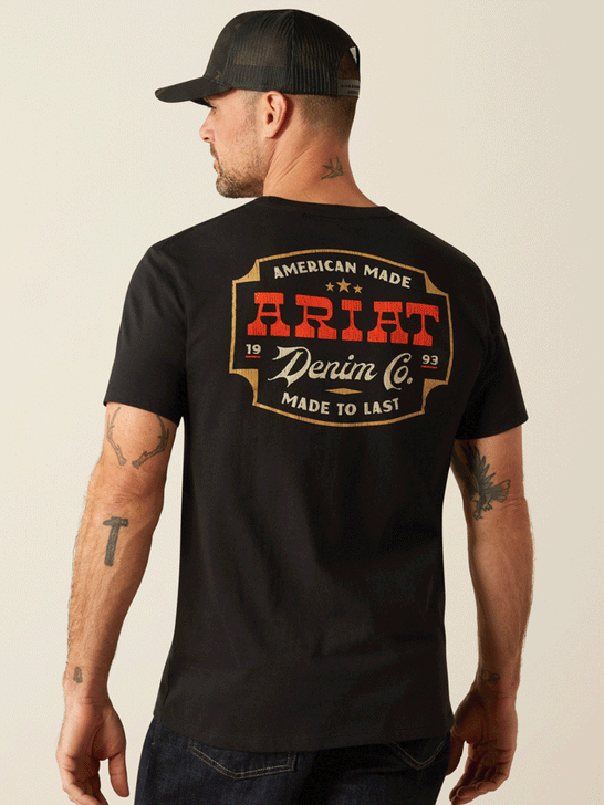 Ariat 10054006 Mens Denim Badge T-Shirt Black back. If you need any assistance with this item or the purchase of this item please call us at five six one seven four eight eight eight zero one Monday through Saturday 10:00a.m EST to 8:00 p.m EST