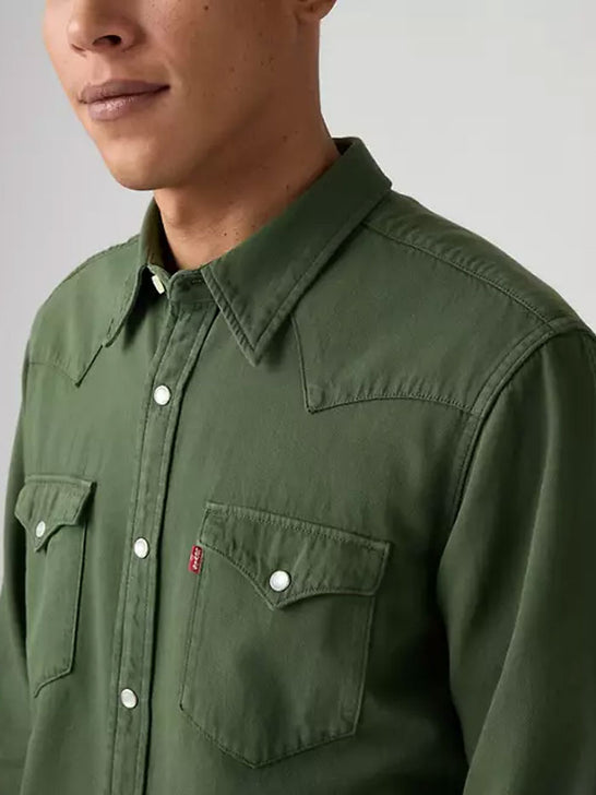 Wrangler 857450234 Mens Classic Denim Western Snap Shirt Green front close up. If you need any assistance with this item or the purchase of this item please call us at five six one seven four eight eight eight zero one Monday through Saturday 10:00a.m EST to 8:00 p.m EST