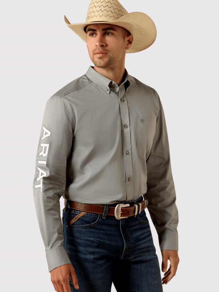 Ariat 10071690 Mens Team Logo Lightweight Twill Fitted Shirt Grey front and side view. If you need any assistance with this item or the purchase of this item please call us at five six one seven four eight eight eight zero one Monday through Saturday 10:00a.m EST to 8:00 p.m EST
