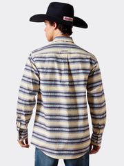 A man shown from the back wearing a long-sleeve western shirt with horizontal beige, blue, and brown stripes, paired with a black cowboy hat and jeans, against a light gray background. If you need any assistance with this item or the purchase of this item please call us at five six one seven four eight eight eight zero one Monday through Saturday 10:00a.m EST to 8:00 p.m EST