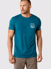 Ariat 10073965 Mens Stripe Patriotic Badge T-Shirt Monaco Blue front view.If you need any assistance with this item or the purchase of this item please call us at five six one seven four eight eight eight zero one Monday through Saturday 10:00a.m EST to 8:00 p.m EST