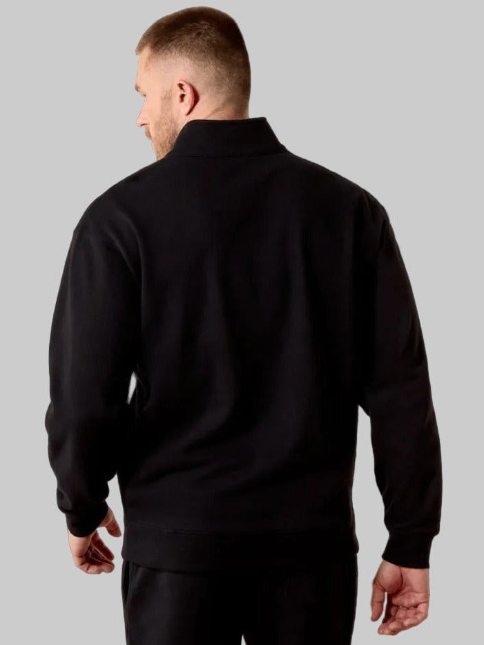 Ariat 10079479 Mens Core 1/4 Zip Sweatshirt Black front view. If you need any assistance with this item or the purchase of this item please call us at five six one seven four eight eight eight zero one Monday through Saturday 10:00a.m EST to 8:00 p.m EST