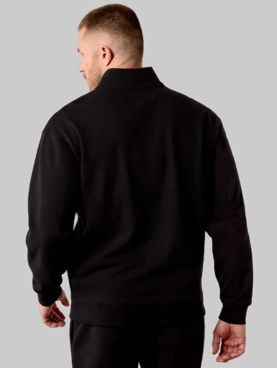 Ariat 10079479 Mens Core 1/4 Zip Sweatshirt Black back view. If you need any assistance with this item or the purchase of this item please call us at five six one seven four eight eight eight zero one Monday through Saturday 10:00a.m EST to 8:00 p.m EST