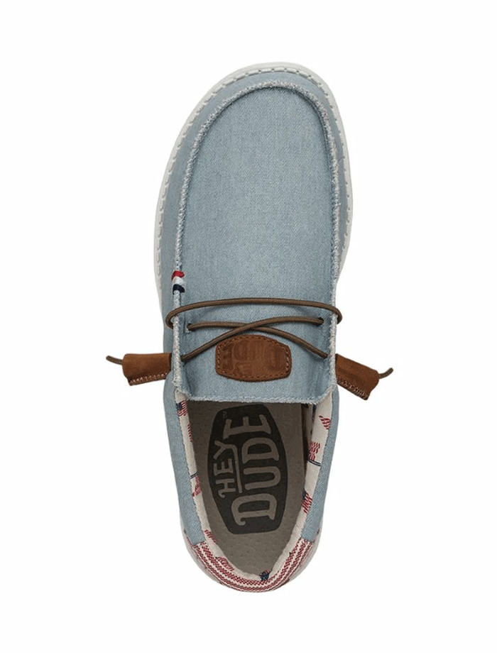Hey Dude 40395-4OE Mens Wally Americana Shoe Denim Stripe front and side view. If you need any assistance with this item or the purchase of this item please call us at five six one seven four eight eight eight zero one Monday through Saturday 10:00a.m EST to 8:00 p.m EST