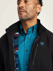 Ariat 10042187 Mens Logo 2.0 Chimayo Jacket Black front close up. If you need any assistance with this item or the purchase of this item please call us at five six one seven four eight eight eight zero one Monday through Saturday 10:00a.m EST to 8:00 p.m EST