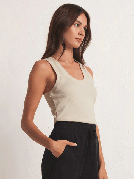 Z Supply ZT231241-OMK Womens Sirena Rib Tank Oat Milk Cream front and side view. If you need any assistance with this item or the purchase of this item please call us at five six one seven four eight eight eight zero one Monday through Saturday 10:00a.m EST to 8:00 p.m EST