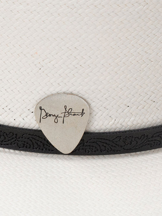 Resistol RSRNRD-304281 RANCH ROAD George Strait Collection 10X Straw Hat Natural guitar pick close up. If you need any assistance with this item or the purchase of this item please call us at five six one seven four eight eight eight zero one Monday through Saturday 10:00a.m EST to 8:00 p.m EST