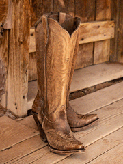 Ariat 10034002 Womens Casanova Western Boot Naturally Distressed Brown view of pair in outdoor set. If you need any assistance with this item or the purchase of this item please call us at five six one seven four eight eight eight zero one Monday through Saturday 10:00a.m EST to 8:00 p.m EST