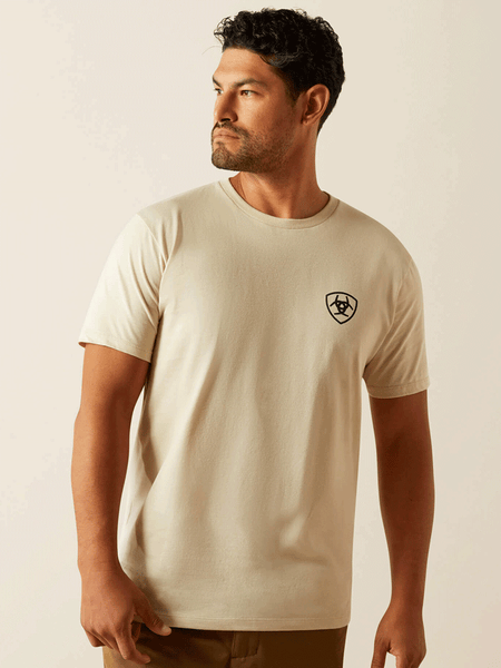 Ariat 10058883 Mens Tenochtitlan Shield T-Shirt Natural front view. If you need any assistance with this item or the purchase of this item please call us at five six one seven four eight eight eight zero one Monday through Saturday 10:00a.m EST to 8:00 p.m EST

