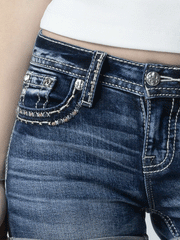 Miss Me M5014H401 Womens Barely Stitched Pink Shorts Denim Blue close up view of front pocket. If you need any assistance with this item or the purchase of this item please call us at five six one seven four eight eight eight zero one Monday through Saturday 10:00a.m EST to 8:00 p.m EST