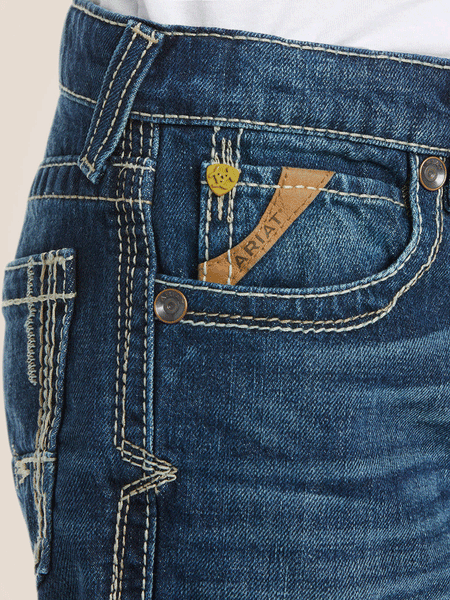 Ariat 10018338 Kids B5 Slim Boundary Stackable Straight Leg Jean Cyclone Navy front pocket close up view. If you need any assistance with this item or the purchase of this item please call us at five six one seven four eight eight eight zero one Monday through Saturday 10:00a.m EST to 8:00 p.m EST