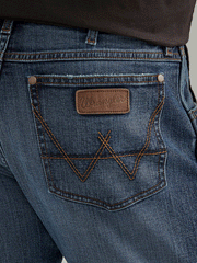 Wrangler 112338536 Mens Retro Slim Fit Straight Leg Jean Gaffrey back pocket close up view. If you need any assistance with this item or the purchase of this item please call us at five six one seven four eight eight eight zero one Monday through Saturday 10:00a.m EST to 8:00 p.m EST