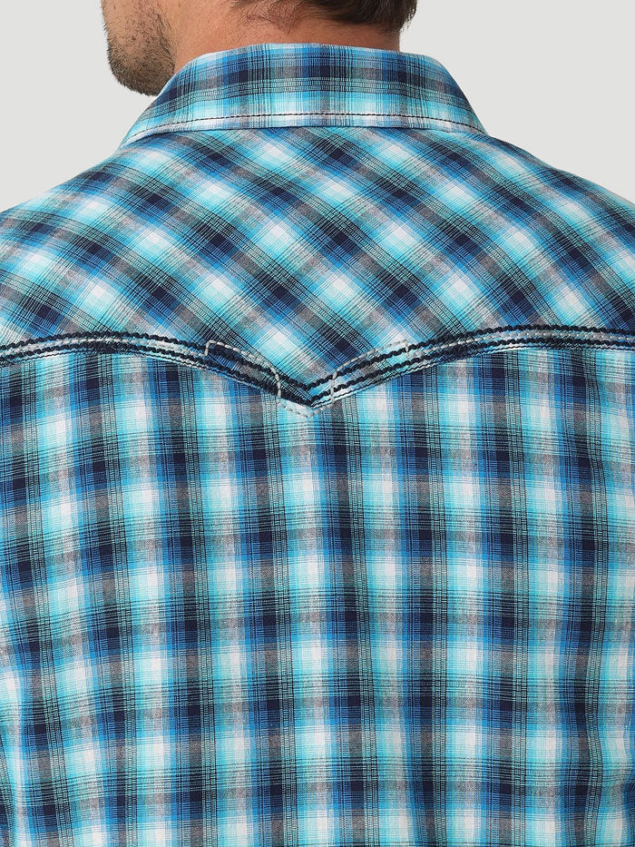 Wrangler 112326348 Mens Rock 47 Long Sleeve Western Snap Shirt Vibrant Blue front view on model. If you need any assistance with this item or the purchase of this item please call us at five six one seven four eight eight eight zero one Monday through Saturday 10:00a.m EST to 8:00 p.m EST