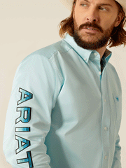 Ariat 10048717 Mens Team Logo Twill Fitted Shirt Light Aqua sleeve view. If you need any assistance with this item or the purchase of this item please call us at five six one seven four eight eight eight zero one Monday through Saturday 10:00a.m EST to 8:00 p.m EST