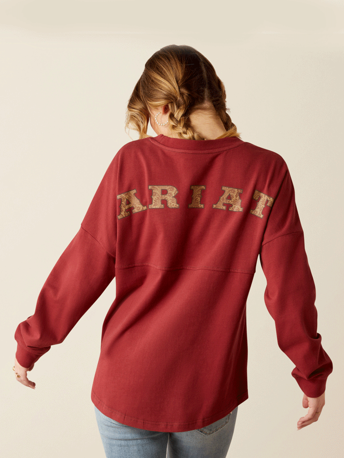 Ariat 10053891 Womens Tooled Logo Oversized Tee Burnt Russet front. If you need any assistance with this item or the purchase of this item please call us at five six one seven four eight eight eight zero one Monday through Saturday 10:00a.m EST to 8:00 p.m EST