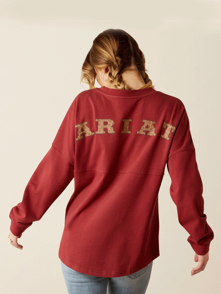 Ariat 10053891 Womens Tooled Logo Oversized Tee Burnt Russet back. If you need any assistance with this item or the purchase of this item please call us at five six one seven four eight eight eight zero one Monday through Saturday 10:00a.m EST to 8:00 p.m EST