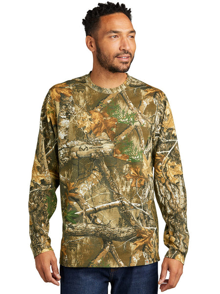 Russell Outdoors RU100LSP Mens Long Sleeve Pocket Tee Realtree Edge front view. If you need any assistance with this item or the purchase of this item please call us at five six one seven four eight eight eight zero one Monday through Saturday 10:00a.m EST to 8:00 p.m EST