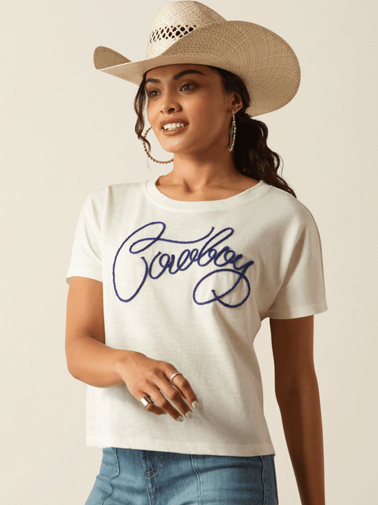 Ariat 10055139 Womens Cowboy T-Shirt Cloud Dancer front view. If you need any assistance with this item or the purchase of this item please call us at five six one seven four eight eight eight zero one Monday through Saturday 10:00a.m EST to 8:00 p.m EST