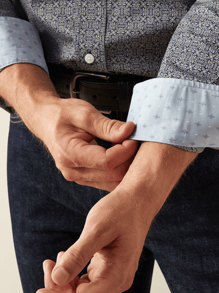Ariat 10058950 Mens Wrinkle Free Douglas Classic Fit Shirt Dark Blue cuff close up. If you need any assistance with this item or the purchase of this item please call us at five six one seven four eight eight eight zero one Monday through Saturday 10:00a.m EST to 8:00 p.m EST