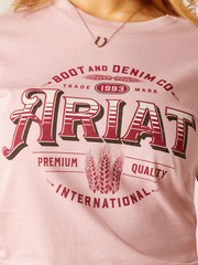 Ariat 10047605 Womens Western Wheat T-Shirt Dusty Pink front design close up. If you need any assistance with this item or the purchase of this item please call us at five six one seven four eight eight eight zero one Monday through Saturday 10:00a.m EST to 8:00 p.m EST
