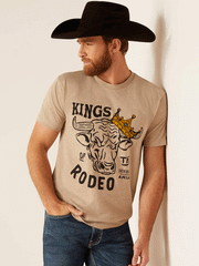 Ariat 10047841 Unisex Sendero King Cow T-Shirt Oatmeal Heather front view on male model. If you need any assistance with this item or the purchase of this item please call us at five six one seven four eight eight eight zero one Monday through Saturday 10:00a.m EST to 8:00 p.m EST