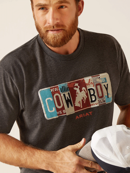 Ariat 10047881 Mens License Plate Cowboy T-Shirt Charcoal Heather front close up. If you need any assistance with this item or the purchase of this item please call us at five six one seven four eight eight eight zero one Monday through Saturday 10:00a.m EST to 8:00 p.m EST