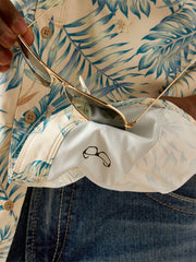 Ariat 10058855 Mens VentTEK Outbound Fitted Shirt Khaki Palm Print lens cloth close up. If you need any assistance with this item or the purchase of this item please call us at five six one seven four eight eight eight zero one Monday through Saturday 10:00a.m EST to 8:00 p.m EST