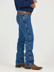 Wrangler 47MWZDS Mens Premium Cowboy Cut Regular Fit Jeans Dark Stone side view. If you need any assistance with this item or the purchase of this item please call us at five six one seven four eight eight eight zero one Monday through Saturday 10:00a.m EST to 8:00 p.m EST