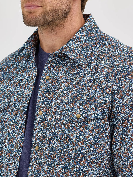 Wrangler 112368223 Mens Retro Premium Long Sleeve Western Snap Shirt Speckly Blue front close up. If you need any assistance with this item or the purchase of this item please call us at five six one seven four eight eight eight zero one Monday through Saturday 10:00a.m EST to 8:00 p.m EST
