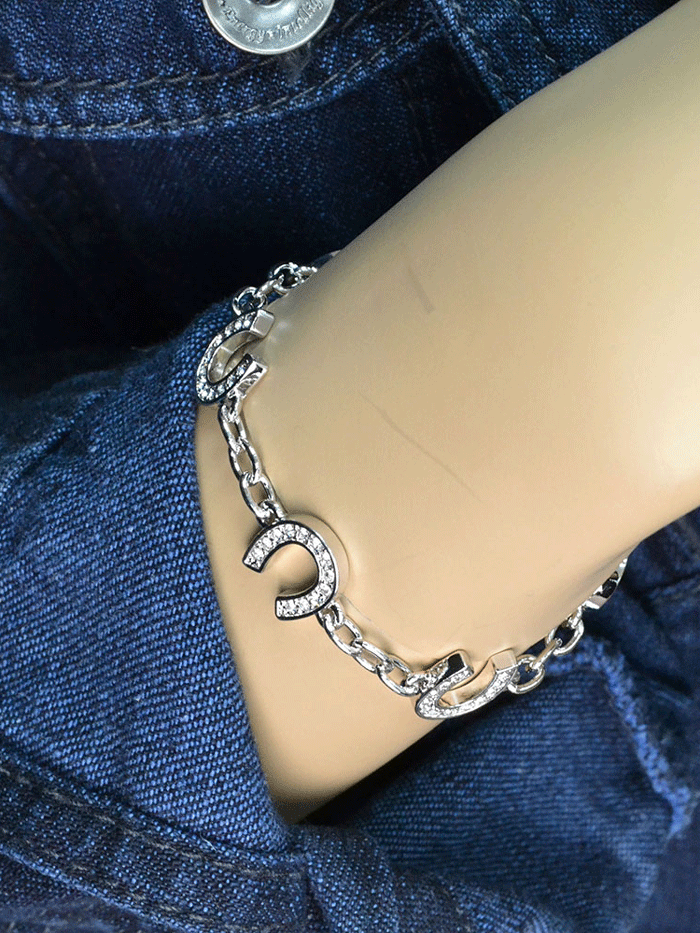 Montana Silversmiths BC620 Womens Crystal Clear Lucky Horseshoe Link Bracelet Silver front. If you need any assistance with this item or the purchase of this item please call us at five six one seven four eight eight eight zero one Monday through Saturday 10:00a.m EST to 8:00 p.m EST