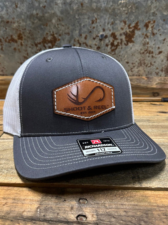 Shoot & Reel SR14 Hexagon Company Logo Patch Curved Bill Cap Charcoal Grey front / side view. If you need any assistance with this item or the purchase of this item please call us at five six one seven four eight eight eight zero one Monday through Saturday 10:00a.m EST to 8:00 p.m EST