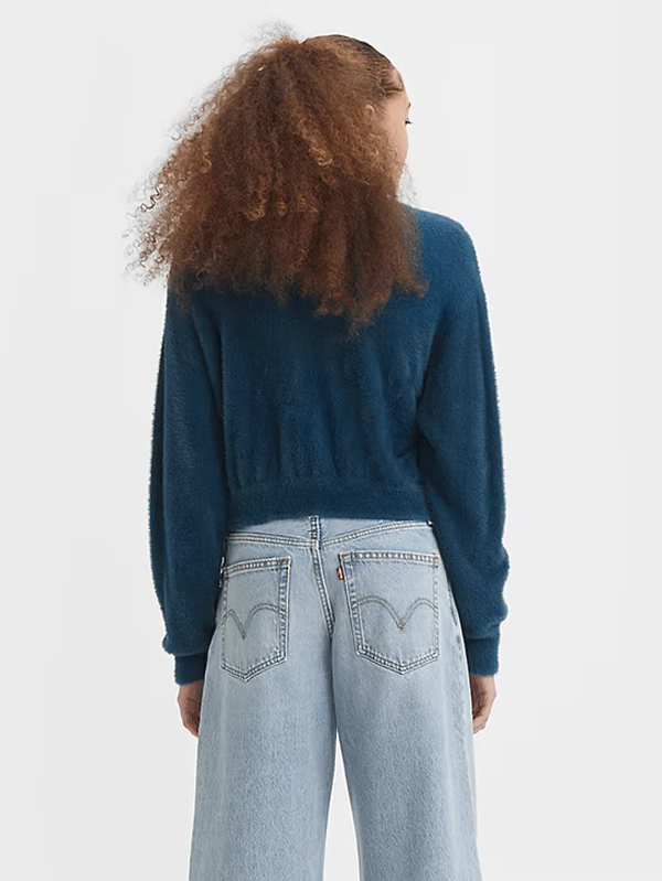 Levis A32350006 Womens Cat Cardigan Sweater Gibralter Sea Blue front view on model. If you need any assistance with this item or the purchase of this item please call us at five six one seven four eight eight eight zero one Monday through Saturday 10:00a.m EST to 8:00 p.m EST