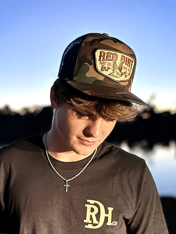 Red Dirt RDHC-489 FLY SOUTH Trucker Cap Black Camo front view. If you need any assistance with this item or the purchase of this item please call us at five six one seven four eight eight eight zero one Monday through Saturday 10:00a.m EST to 8:00 p.m EST