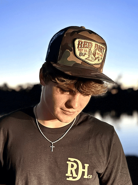 Red Dirt RDHC-489 FLY SOUTH Trucker Cap Black Camo on human model. If you need any assistance with this item or the purchase of this item please call us at five six one seven four eight eight eight zero one Monday through Saturday 10:00a.m EST to 8:00 p.m EST