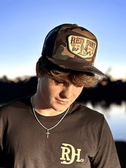 Red Dirt RDHC-489 FLY SOUTH Trucker Cap Black Camo on human model. If you need any assistance with this item or the purchase of this item please call us at five six one seven four eight eight eight zero one Monday through Saturday 10:00a.m EST to 8:00 p.m EST