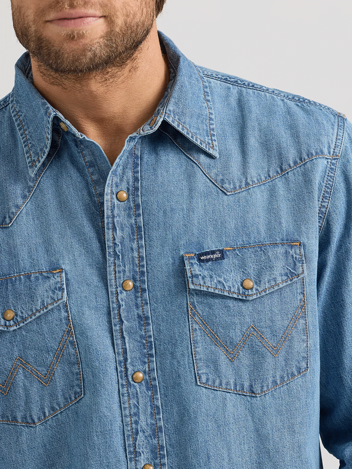 Wrangler 112361699 Mens Classic Denim Western Snap Shirt Light Wash front view. If you need any assistance with this item or the purchase of this item please call us at five six one seven four eight eight eight zero one Monday through Saturday 10:00a.m EST to 8:00 p.m EST