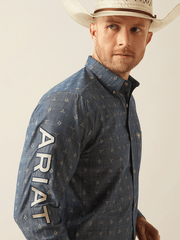 Ariat 10054732 Mens Team Philibert Classic Fit Shirt Chambray Blue arm view. If you need any assistance with this item or the purchase of this item please call us at five six one seven four eight eight eight zero one Monday through Saturday 10:00a.m EST to 8:00 p.m EST

