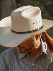 Stetson SSLLNO-304281 LLANO 10X Straw Hat Natural on model. If you need any assistance with this item or the purchase of this item please call us at five six one seven four eight eight eight zero one Monday through Saturday 10:00a.m EST to 8:00 p.m EST