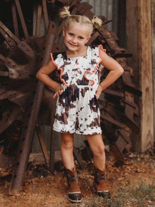 Shea Baby JUP05 Kids Cowprint Romper Brown view on model. If you need any assistance with this item or the purchase of this item please call us at five six one seven four eight eight eight zero one Monday through Saturday 10:00a.m EST to 8:00 p.m EST
