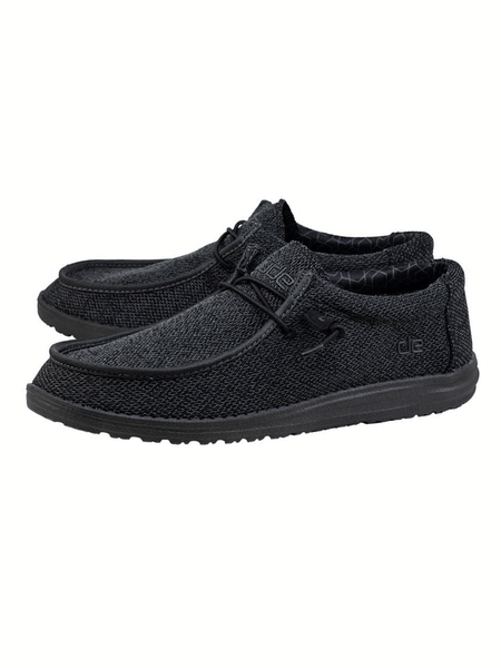 Hey Dude 150204942 Mens Wally Sox Micro Total Black front and side view. If you need any assistance with this item or the purchase of this item please call us at five six one seven four eight eight eight zero one Monday through Saturday 10:00a.m EST to 8:00 p.m EST