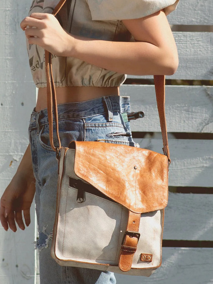 Bed Stu A610012-NTTNRS-X Womens Venice Beach Crossbody Handbag Nectar Lux Tan Rustic front view on model. If you need any assistance with this item or the purchase of this item please call us at five six one seven four eight eight eight zero one Monday through Saturday 10:00a.m EST to 8:00 p.m EST