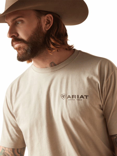 Ariat 10047888 Mens Zuni Flag Short Sleeve Tee Khaki Heather close up view of front. If you need any assistance with this item or the purchase of this item please call us at five six one seven four eight eight eight zero one Monday through Saturday 10:00a.m EST to 8:00 p.m EST